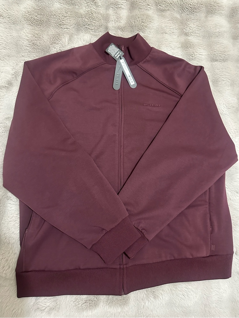 NWT Nike x Skims Women's
SKIMS Matte Tricot Oversized Track Jacket Currant Sz S